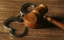 Close-up view of brown wooden mallet of judge