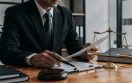 lawyer-working-document-with-scales-justice